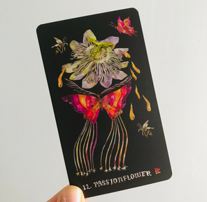 a card with the image of a passionflower and butterflies and the text "12. passionflower"